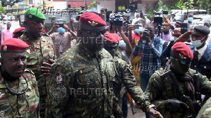 FILE PHOTO: FILE PHOTO: Special forces commander Mamady Doumbouya, who ousted President Conde, walks out after meeting the envoys from ECOWAS about the Guinea crisis to discuss ways steer the country back toward a constitutional