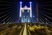 People attend a running event on the newly constructed cable-stayed, Rama X Bridge or 