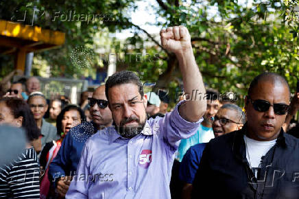 Sao Paulo mayor candidate leftist Guilherme Boulos gestures after voting at a polling station during the municipal elections in Sao Paulo