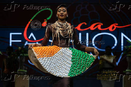 A model presents a dress covered of chocolates packaged in the colours of the Ivorian flag during the ninth edition of the National Cocoa and Chocolate Days in Abidjan