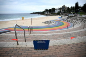 Tar balls washed ashore forces closure of Coogee Beach