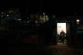 Israelis gather at a bomb shelter following rocket attacks from Lebanon towards Israel, in Acre