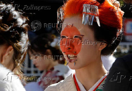 Kimono-clad young women stand at the venue for their Coming of Age Day celebration ceremony in Yokohama