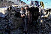 Afghans living in a camp amidst drop in temperatures in Kabul