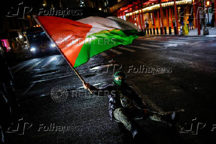 Pro-Palestinian protesters rally to stand with Palestinians in Gaza following the announcement of the ceasefire, in New York