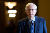 Senate Minority Leader Mitch McConnell walks to the Senate floor for a vote on Capitol Hill in Washington