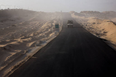 An Israeli military vehicle drives through the Philadelphi Corridor area in southern Gaza