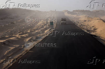 An Israeli military vehicle drives through the Philadelphi Corridor area in southern Gaza