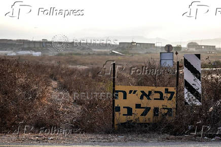 A Hebrew sign shows the direction to a military base, the scene of where a drone from Lebanon attacked Israel, amid cross-border hostilities between Hezbollah and Israel, in Binyamina