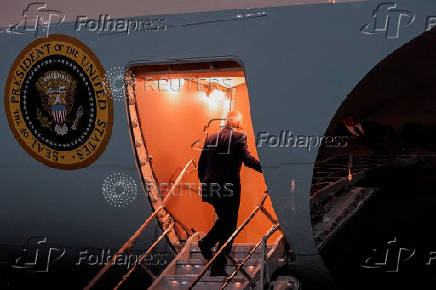 U.S. President Joe Biden and first lady Jill Biden walk boards Air Force One as he departs for Joint Base Andrews from John F. Kennedy International Airport in New York