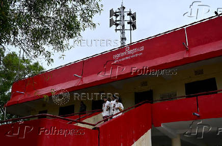 Volunteers descend a tsunami warning centre, during a mock drill to prepare against tsunami, ahead of the 20th anniversary of the