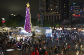 People visit a Christmas theme park in New Taipei City