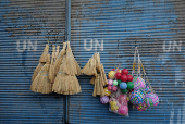 Brooms and balls are displayed for sell at the old city, in Damascus,