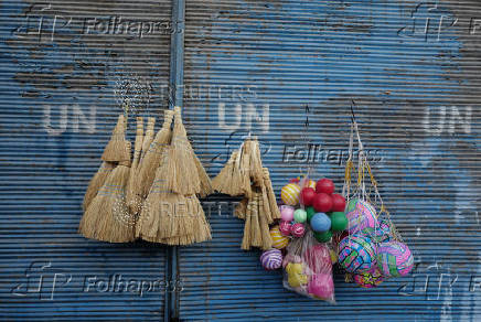 Brooms and balls are displayed for sell at the old city, in Damascus,