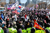 Impeached South Korean President Yoon Suk Yeol's supporters rally near the Corruption Investigation Office for High-ranking Officials, following his arrest, in Gwacheon