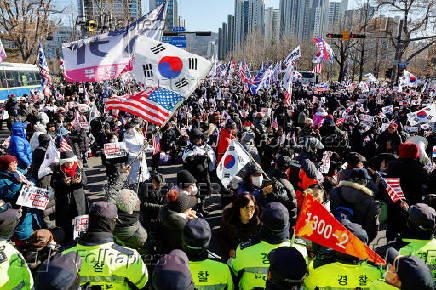 Impeached South Korean President Yoon Suk Yeol's supporters rally near the Corruption Investigation Office for High-ranking Officials, following his arrest, in Gwacheon