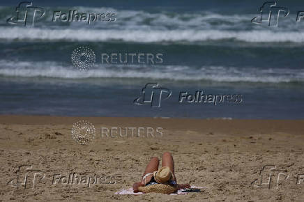 People spend time on the beach, in Tel Aviv,