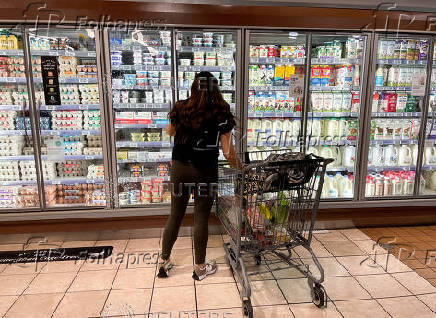 FILE PHOTO: A woman shops in a supermarket in Los Angeles
