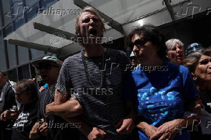 Climate control activists demonstrate outside the global headquarters of Citigroup in New York City