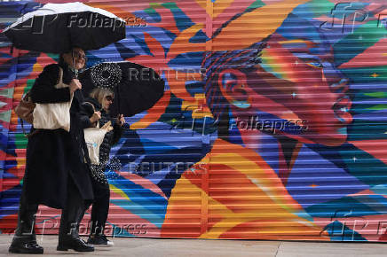 A woman looks ahead on a rainy day in New York