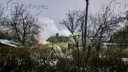 Smoke billows following a DHL cargo plane crash in Vilnius