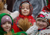 Children dressed in traditional Ukrainian costumes attend a Christmas celebration in Lviv