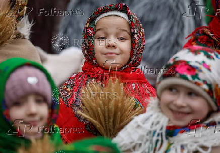 Children dressed in traditional Ukrainian costumes attend a Christmas celebration in Lviv