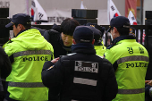 Pro-Yoon protesters participate in a rally outside a court, in Seoul