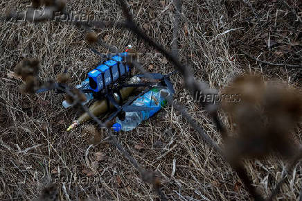 Ukrainian servicemen practice with an FPV drone, in Kharkiv region