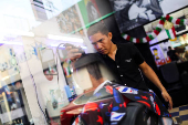 Ecuadorian immigrant Kenyi Arturo Melendez Sanchez, which had his asylum appointment canceled through the CBP One app and applied for asylum in Mexico, works in a barber shop in Tapachula