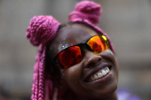 A reveller takes part in the 'Chora Me Liga' block party during a pre-Carnival parade in Rio de Janeiro