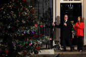 British Prime Minister Starmer and his wife switch on the Downing Street Christmas tree lights, in London