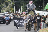 People rally on Human Rights Day in Jakarta