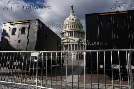 Police vehicles are parked outside the US Capitol building in Washington