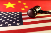 FILE PHOTO: Illustration shows U.S. and Chinese flags and gavel