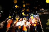 People gather to mark the second birthday of the youngest hostage in Gaza, Kfir Bibas, in Tel Aviv