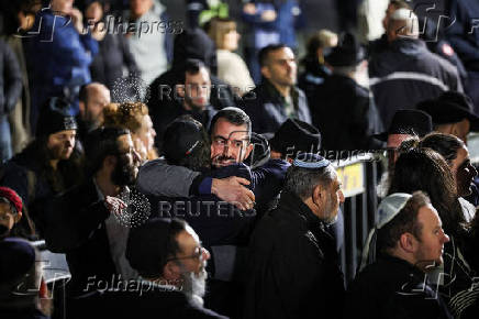 Mourners attend the funeral of Israeli rabbi, Zvi Kogan, in Kfar Habad