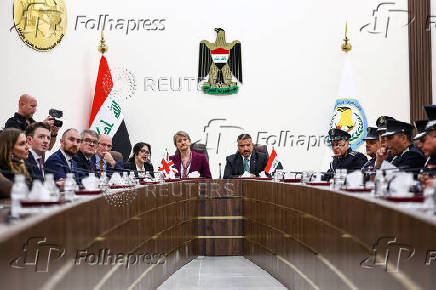 Britain's Home Secretary Yvette Cooper meets Iraq's Minister of Interior Abdul Amir Al-Shammari, in Baghdad