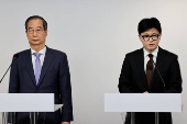 South Korean Prime Minister Han Duck-soo and ruling People Power Party leader Han Dong Hoon release a joint public statement, in Seoul