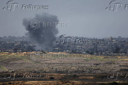 Smoke billows in the Gaza Strip, amid the ongoing conflict between Israel and Hamas, as seen from southern Israel