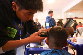 The Good Samaritan clothes and feeds homeless people during the holidays, in La Paz