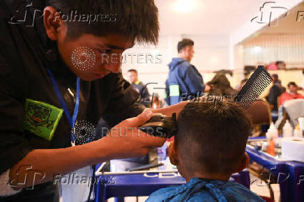 The Good Samaritan clothes and feeds homeless people during the holidays, in La Paz