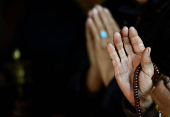 Tibetans in Nepal offer prayers at a monastery in memory of those killed in the recent earthquake, at the Tibetan Refugee Camp in Lalitpur