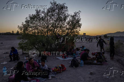 Migrants arrive at an encampment along the Rio Grande river in Ciudad Juarez