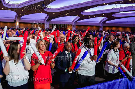 People chant before U.S. President Biden delivers his remarks at a conference held by the North America's Building Trades Unions, in Washington
