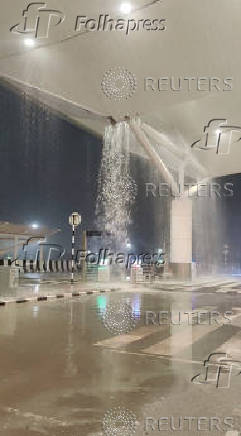Water seeps through the roof amid heavy rain at Terminal 1 of the Indira Gandhi International Airport, New Delhi