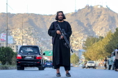 Afghans Taliban conduct checks on people and vehicles at checkpoints in Kabul