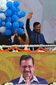 FILE PHOTO: Delhi Chief Minister and leader of Aam Aadmi Party Arvind Kejriwal waves to his supporters during celebrations at the party headquarters in New Delhi