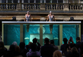 Artistic swimming performance event to mark 100 days before the 2024 Paris Olympic Games starts, in London