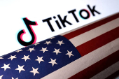 FILE PHOTO: Illustration shows U.S. flag and TikTok logo